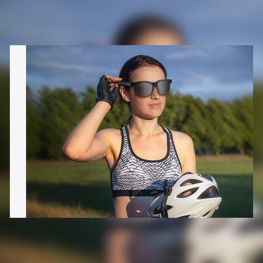SonicShades Sport edition - woman cycling with polarized audio sunglasses